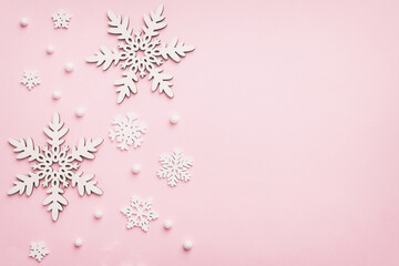 New Year composition white christmas snowflakes. Christmas decor background with pine cones. Top view with copy space