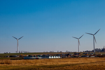 Wind turbines in a village. Renewable energy