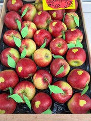 Red Apples with Hearts on them in a wooden box
