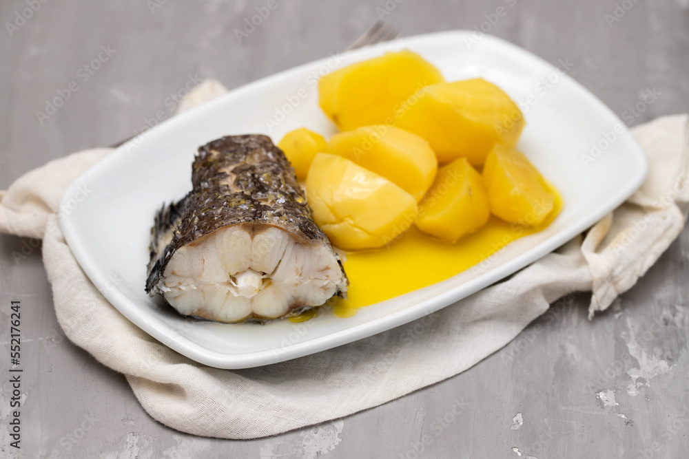 Poster boiled vegetables with boiled fish on white plate