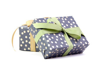 Gift boxes with ribbon bow isolated on white. Wrapped Christmas or birthday green color gift boxes