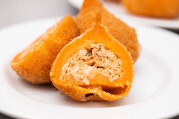 traditional brasilian fried drumsticks Coxinha de frango on dish