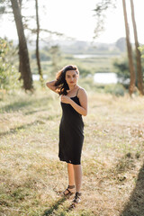 Young woman walking in forest