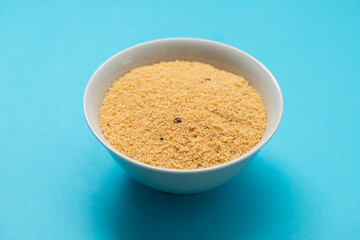 Farofa, typical brazilian manioc flour side dish on blue