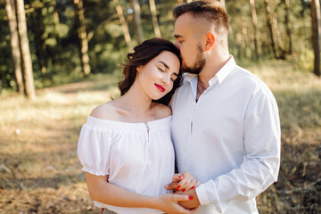 Fototapeta premium Young couple in love walking in the park