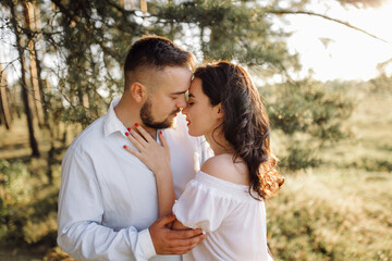 Obraz premium Young couple in love walking in the park