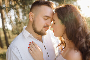 Fototapeta premium Young couple in love walking in the park