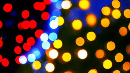 background blurred abstraction of colored lanterns and decorations. bokeh texture of street colored lights
