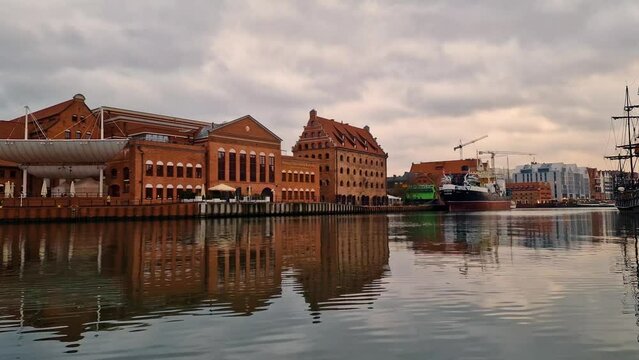 view of the old town of Gdansk port embankment tourists river reflection illumination Gdansk, Poland