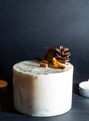 decorative wax candle and decorates with dried flowers, close-up