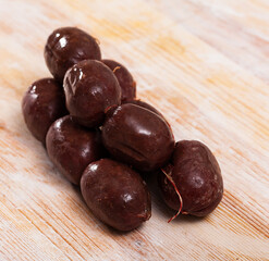 Pile of delicious blood sausages on wooden background