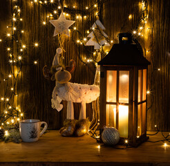 christmas lights and decorations on wooden background