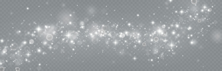 Particles of white magic dust. Shining light particles.Christmas glitter particles. Light effect on a transparent background
