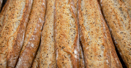 Stack of crispy baguettes at the bakery
