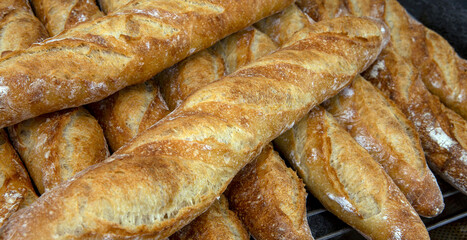 Stack of crispy baguettes at the bakery