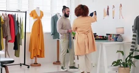 Fashion, collaboration and planning with a designer team working in a studio for creative discussion. Business, style and teamwork with a man and woman design employee at work in a clothes workshop - Powered by Adobe