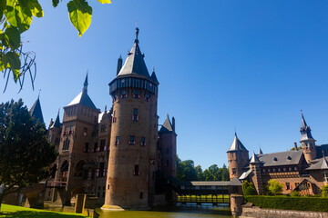 Fototapeta premium Dutch castle surrounded by moat, De Haar Castle, located in Utrecht, Netherlands.