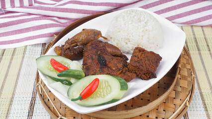 Nasi Ayam Bakar is a Javanese food made from grilled chicken with rice. selective focus