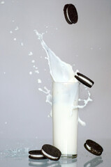 Glass of slashing  milk and falling 