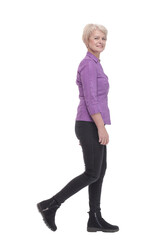 Fototapeta premium full-length. mature woman in purple blouse striding forward.