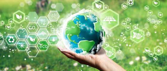 Man´s hands holding the green planet earth. Eco concept, ecology, clean energy and environment.