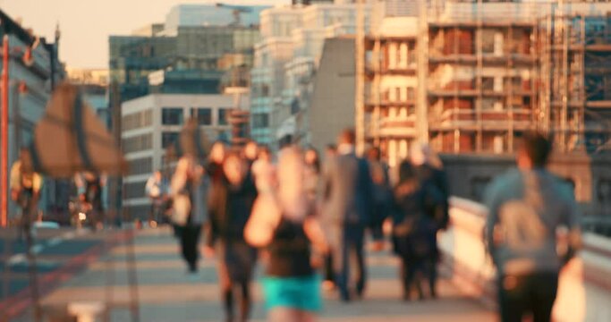 Bokeh, busy and people on a city bridge, work travel, fitness running and morning in an urban society. Blurry, walking and crowd group in the street or road with the population on a walk in London