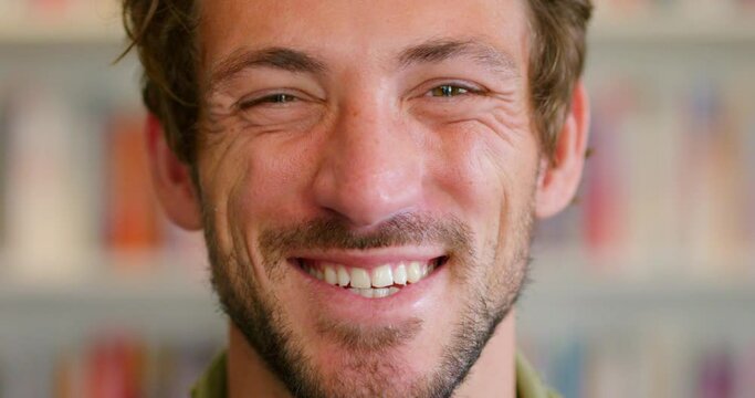 Man, face and smile for happiness portrait in blur background for good news, happy mindset and laughing. Comic facial expression, handsome man and positive attitude lifestyle or thinking funny idea