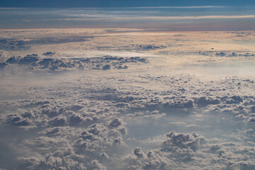 beautiful fluffy clouds from the window of the plane