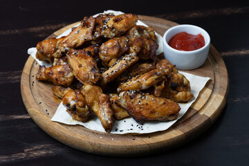 delicious fried chicken wings with sauce