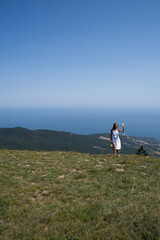 girl taking a selfie on a background of beautiful landscape