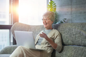 Woman concentrating as she works on a laptop