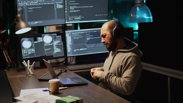 Programming engineer taking vitamins and pills in box, having package with supplements and working late at night. Young app developer using medicaments in coding agency office, html script.