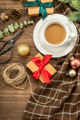 Christmas decorations, gifts and coffee on  wooden background. christmas concept.