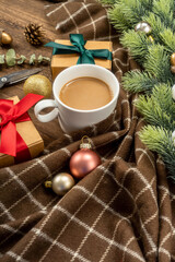 Christmas decorations, gifts and coffee on  wooden background. christmas concept.