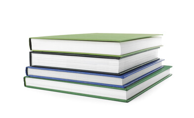 Many different books stacked on white background