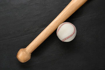 Baseball bat and ball on black background, top view. Sports equipment