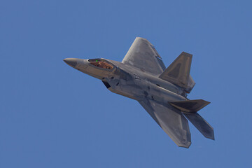 Fototapeta na wymiar Very close view of a F-22 Raptor approaching in beautiful light