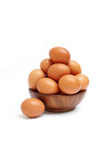 brown eggs in a wooden bowl