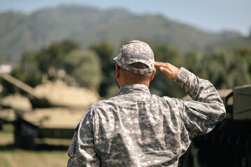 Asian man special forces soldier saluting standing against on the field Mission. Commander Army...