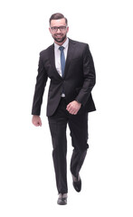 confident young businessman moving forward. isolated on white
