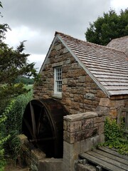 Fototapeta na wymiar Old Gristmill in Park on Pond in Setauket New York