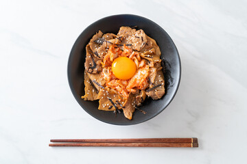 pork bulgogi rice bowl with kimchi and Korean pickled egg