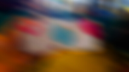 Abstract blurred background with the dominance of white below, there are also other colors such as white, blue, and red.