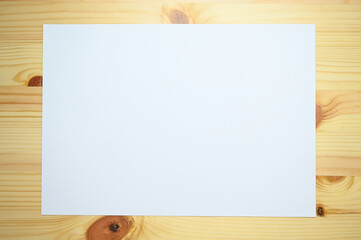 white paper on wooden table, paper textured background