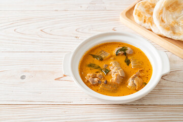 Chicken curry soup with roti