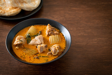 Chicken curry soup with roti