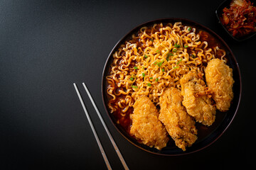 Korean instant noodles with fried chicken or Fried chicken ramyeon