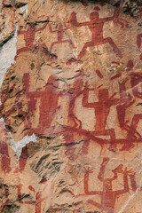 The Zuojiang Huashan Rock Art Cultural Landscape. The paintings have a red color and were executed using a mixture of red ochre (hematite), animal glue, and blood