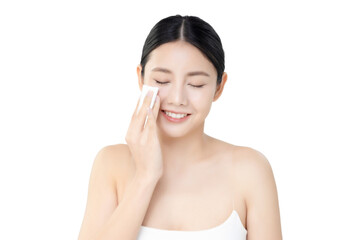 Studio shot Beautiful young Asian woman cleaning face with cotton pad isolated on transparent...