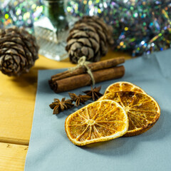 Dried oranges. dried orange slices on wooden board with anise stars, cinnamon sticks. Selective focus.